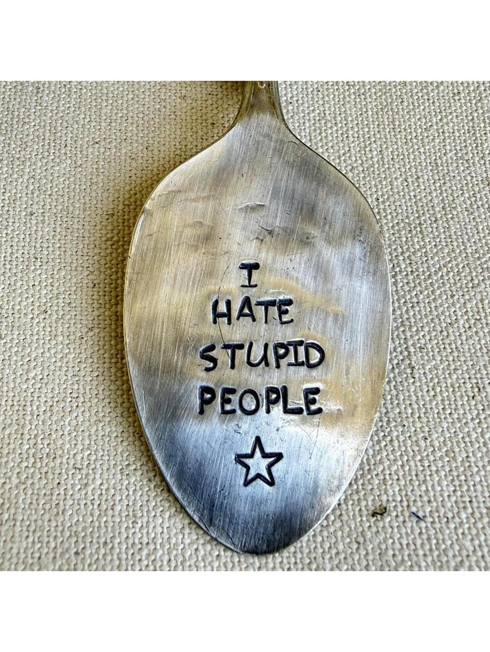 Hand stamped vintage silverplate spoon keychain made from a repurposed teaspoon.